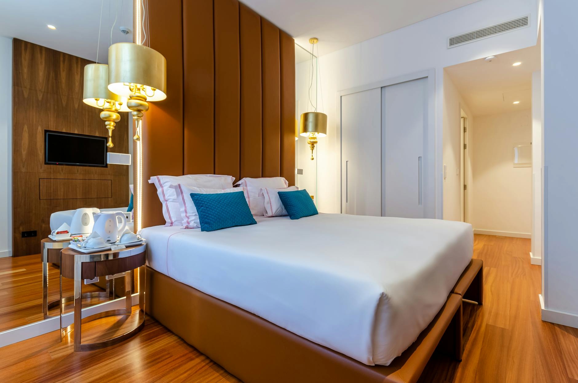 Elegant hotel room with king bed and city view in Bruges